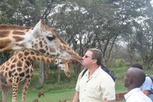 Kissing a giraffe in Kenya